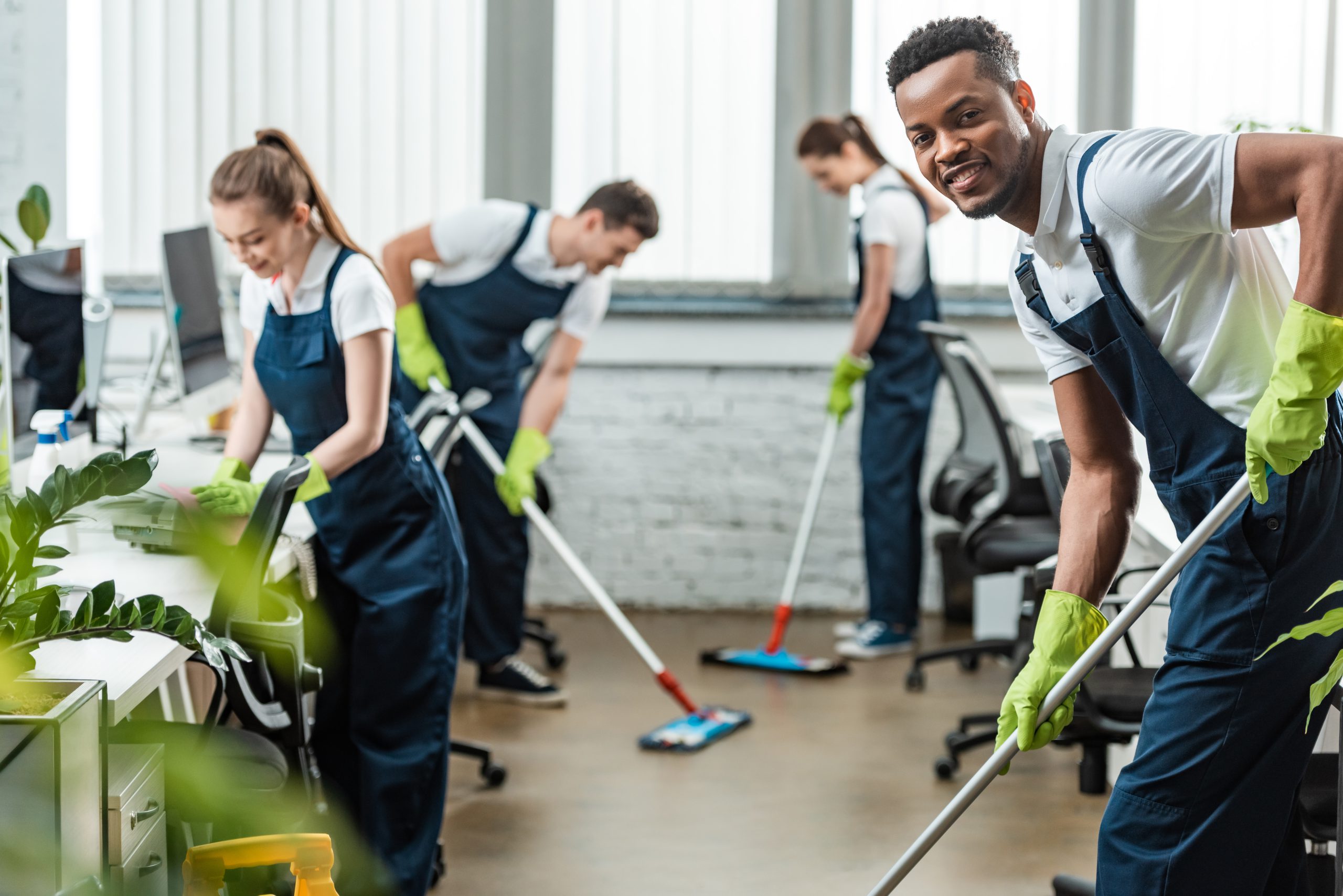 Professional janitorial cleaning team at work